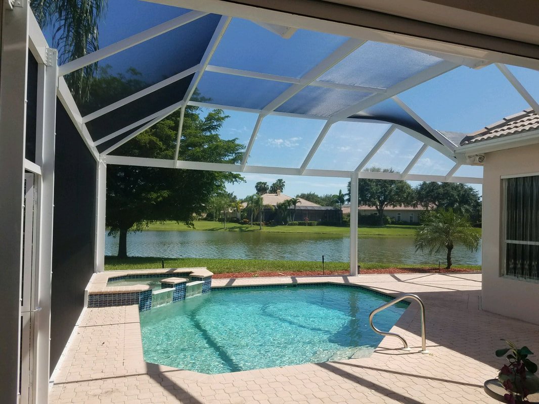 Completed pool enclosure rescreening in Daytona Beach, FL overlooking residential pool